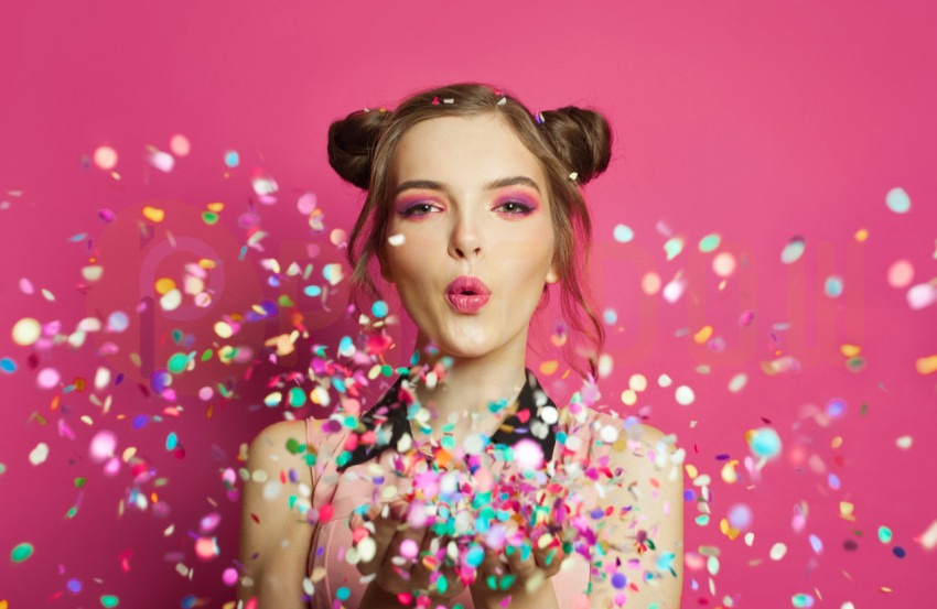 Free Image | Attractive woman with colorful confetti on pink
