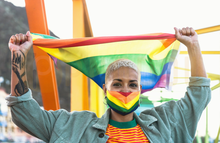 Woman with LGBTQ Flag Wearing LGBTQ Facemask