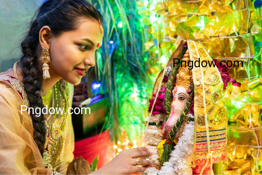 Happy Indian young woman celebrating ganesh chaturthi festival
