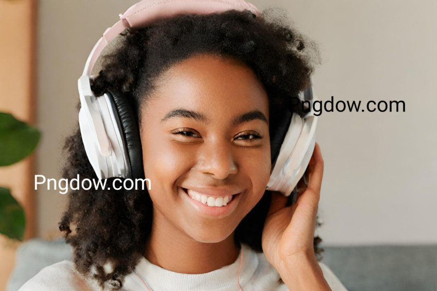 Portrait of smiling young woman listening music with headphones for free